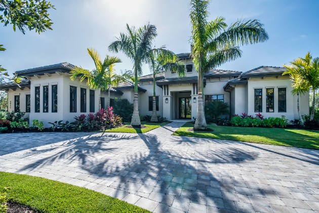 Tropical estate with palm-lined driveway