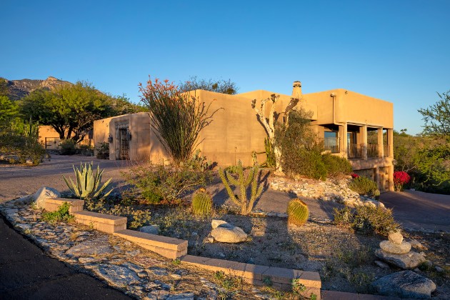 Desert hillside estate with natural landscaping